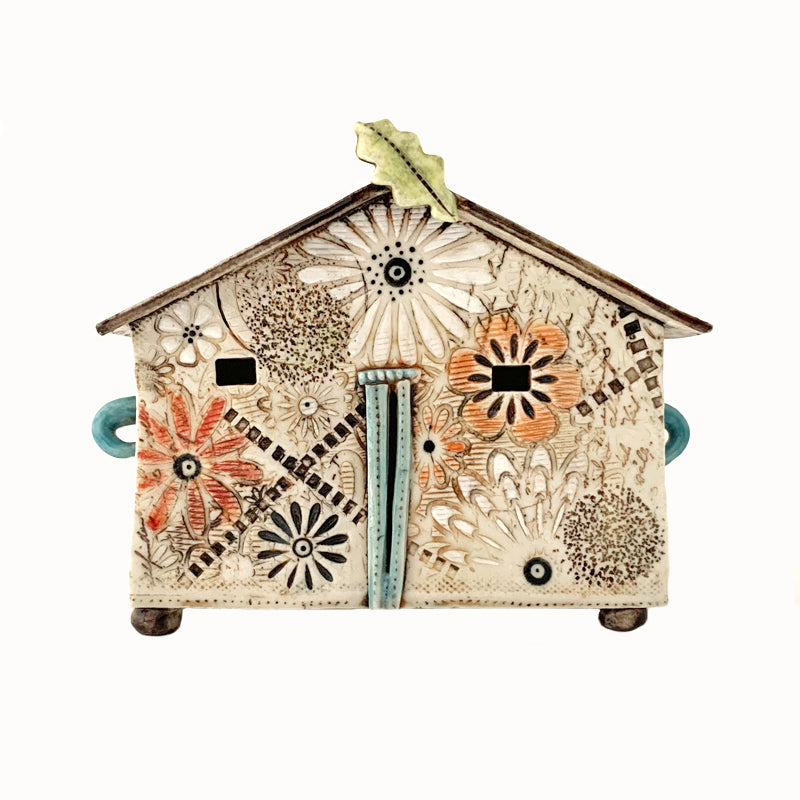 Handmade porcelain house by ceramic artist Barbara Chadwick, flowers with leaf detail on top.