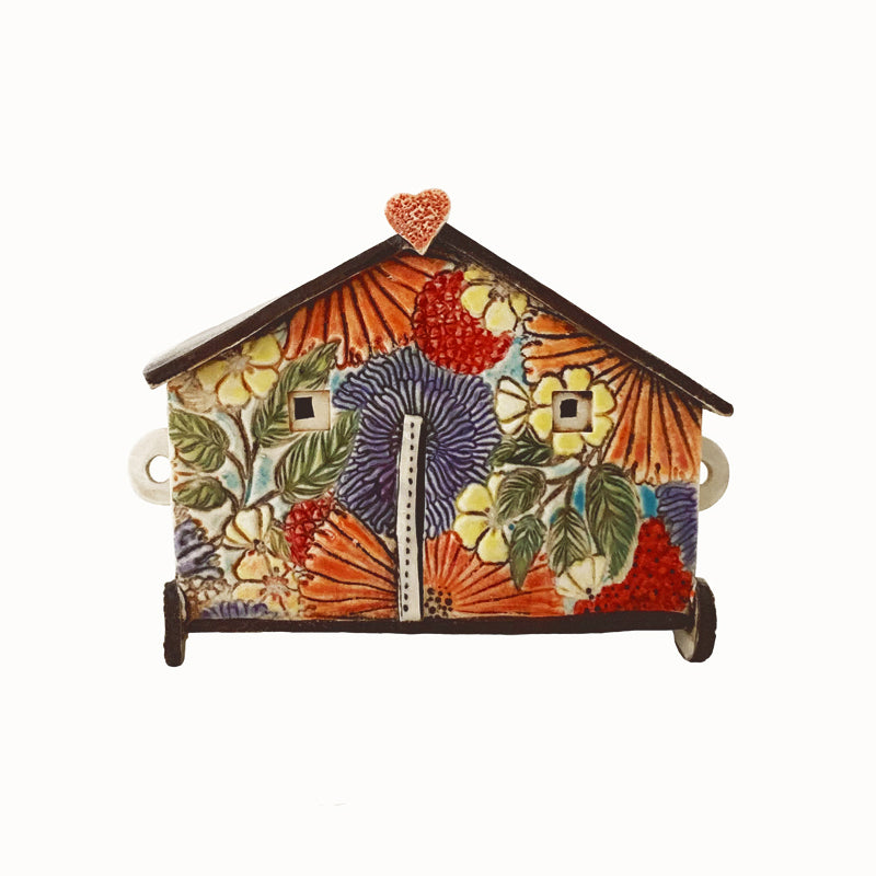 Handmade porcelain house by ceramic artist Barbara Chadwick, colorful flower pattern with heart detail on top.