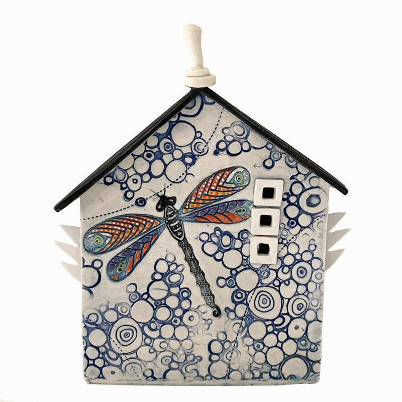 Handmade ceramic house by artist Barbara Chadwick, white with blue circle pattern and dragonfly.
