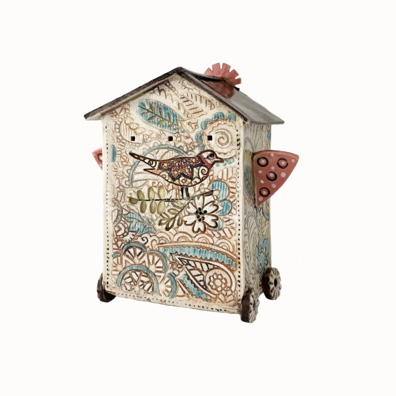 Handmade porcelain house by ceramic artist Barbara Chadwick, botanical details and bird.