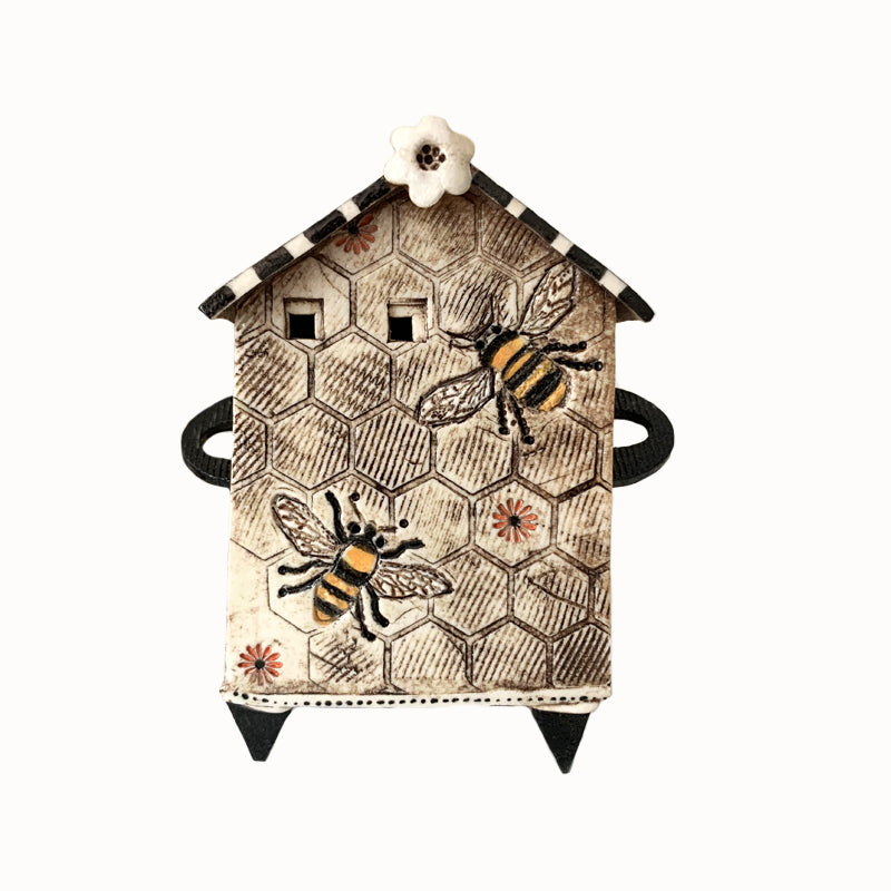 Handmade porcelain house by ceramic artist Barbara Chadwick, honeycomb and bee design.