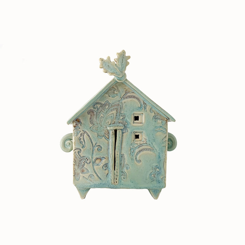Handmade porcelain house by ceramic artist Barbara Chadwick, small seafoam green house with botanical details.