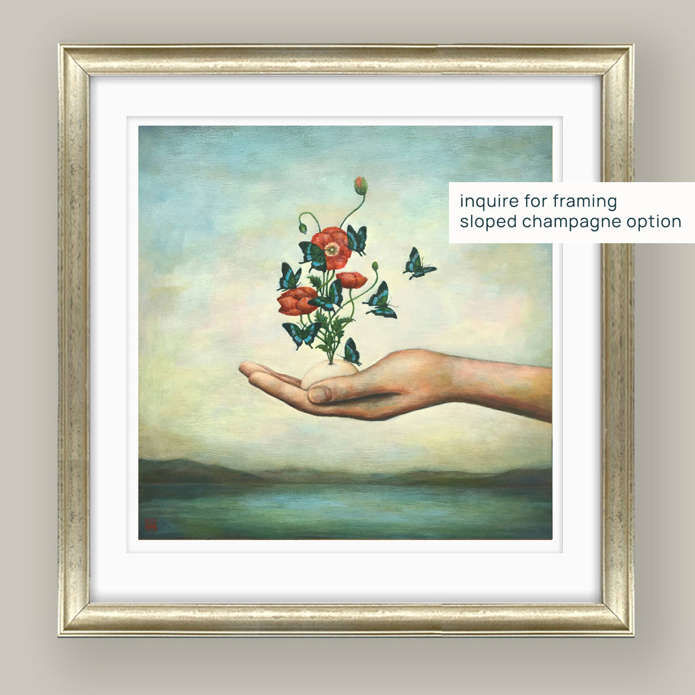 Duy Huynh's "A New Beginning" 10 x 10" limited edition art print on paper with 1 inch white border. A hand holds an egg from which red Icelandic poppies bloom with butterflies swirling around them. Mockup with sloped champagne frame.