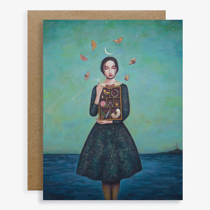 Duy Huynh notecard "Best Wishes", a woman stands under a night sky with a crescent moon and shooting stars. She holds a dandelion and a box of items including a wishbone, horseshoe, shell and feathers. Blank A2 card with envelope.