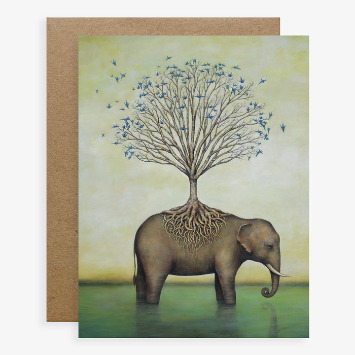 Duy Huynh notecard "Collective Wisdom". An elephant stand in water, a tree is rooted on its back. Blue paper cranes fill the tree. Card is blank inside.