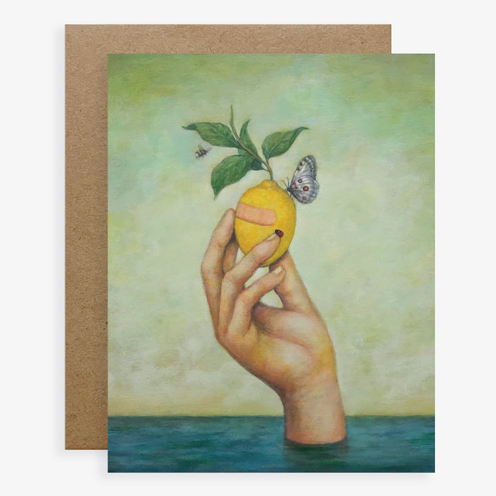 Duy Huynh notecard "Lemon Aid". A hand emerges from the water holding a lemon. The lemon has a band aid on it, and is accompanied by a ladybug, butterfly and bee. Card is blank inside.