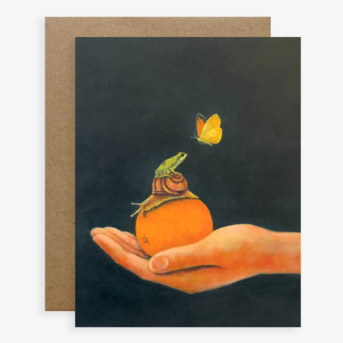 Duy Huynh notecard "Orange You Glad We're Friends?". A hand holds an orange. A snail sits on the orange, a rabbit sits on the snail and looks up at a butterfly. Card is blank inside.