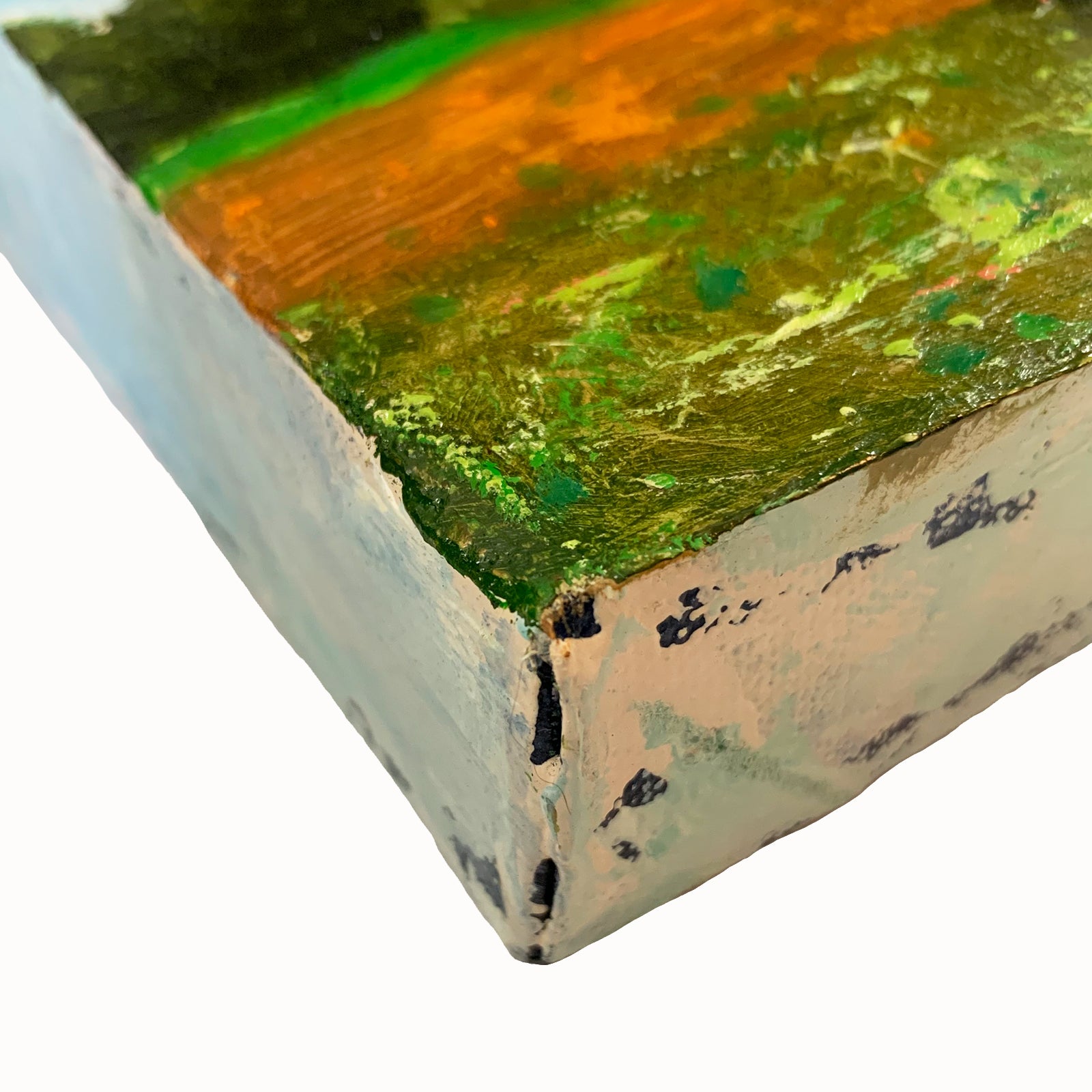 Eleanor Miller's mini painting, "Plowed Field". A side view of  the  plowed field and tree landscape painting.