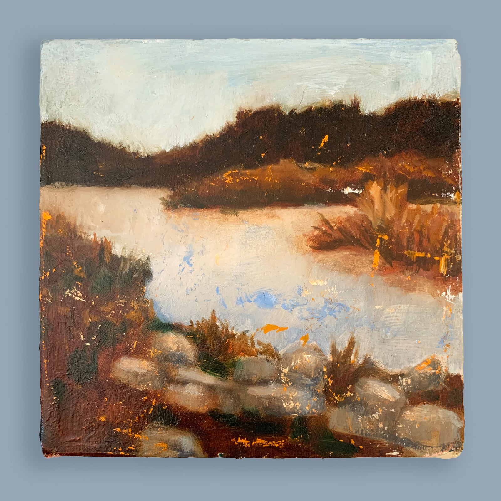 Eleanor Miller's mini painting, "Sanctuary". A peaceful landscape and water painting in soft blues and rusty browns.