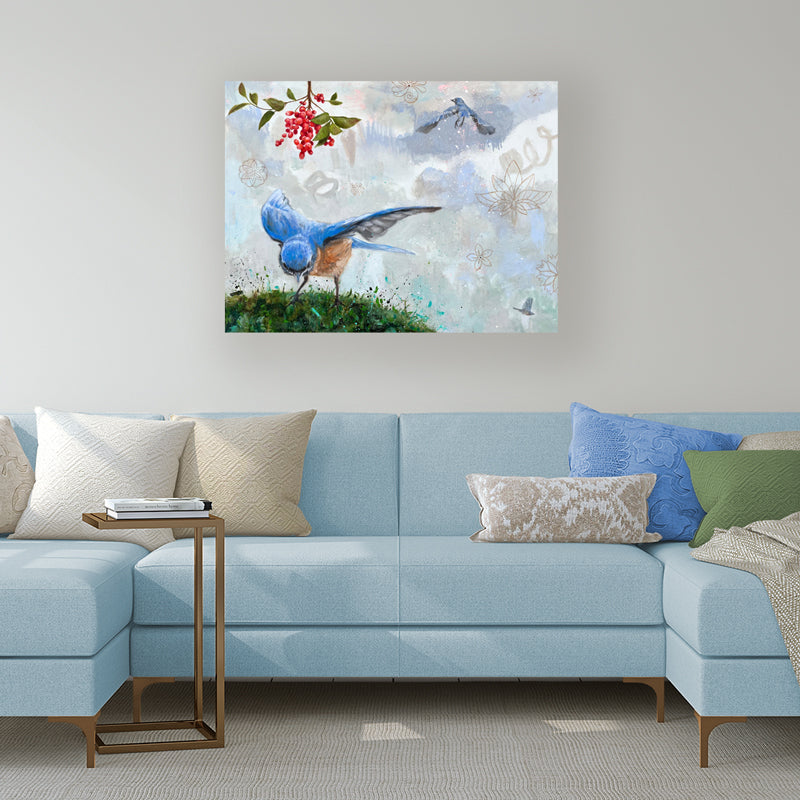 "Sky Blue" painting by Eleanor Miller. Bluebirds, red berries and floral elements on a textured. watercolor  background. Shown in a living room scene over a light blue sofa.