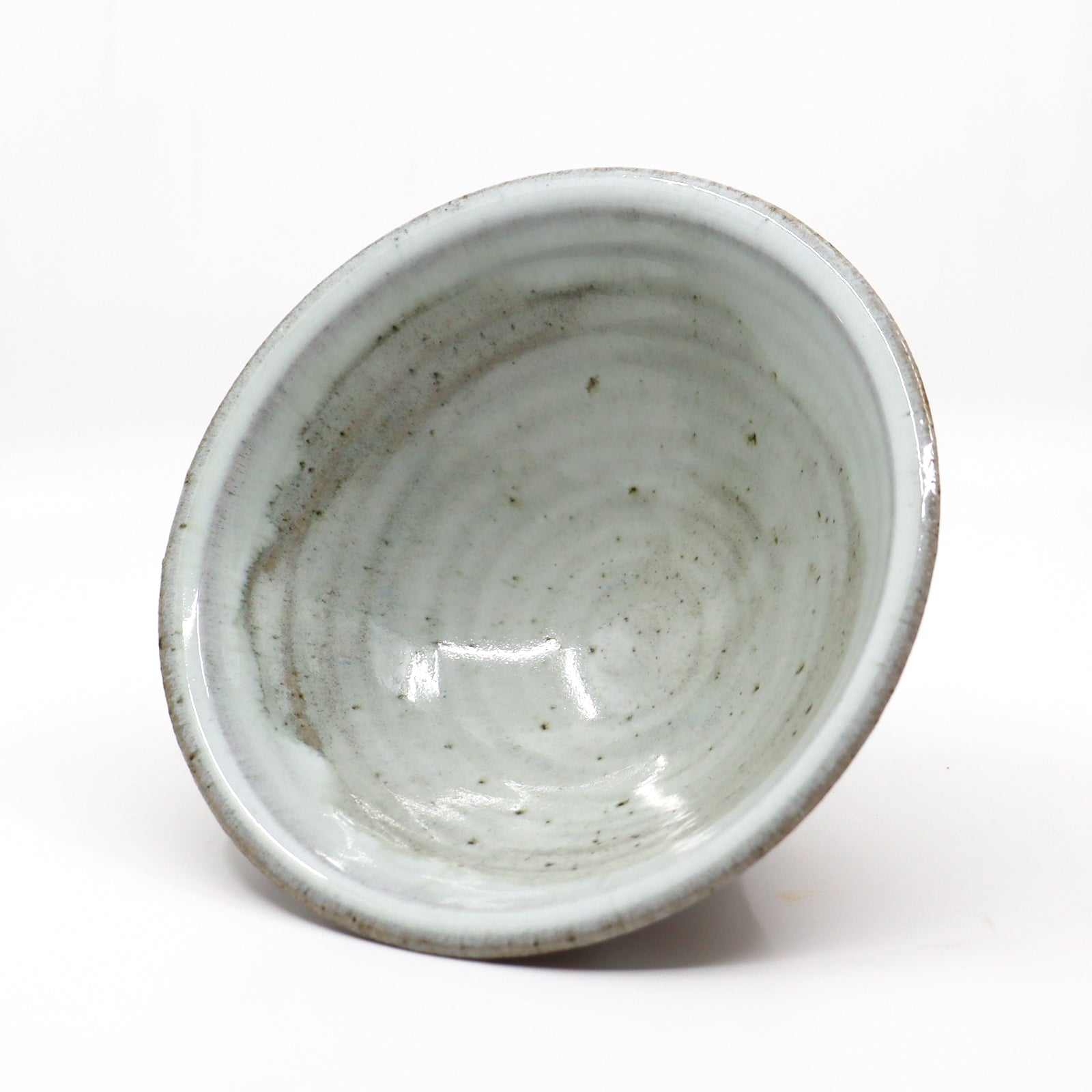 Heather Ossandon handmade, wood-fired ceramics. Cereal bowl, white with rust polka dots. Interior view.