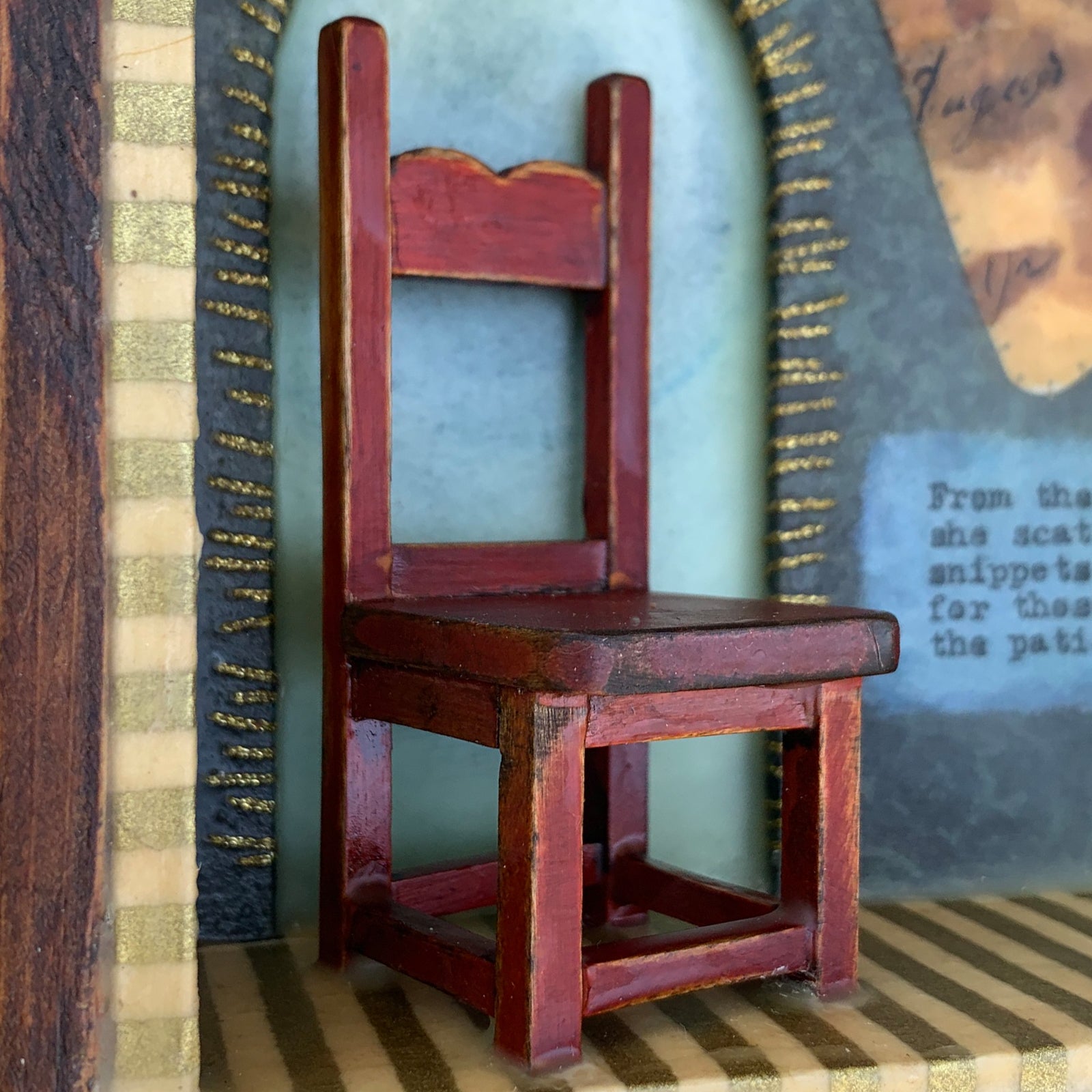 "Snippets of Magic" mixed media and encaustic assemblage by Janet Eskridge. Red chair detail.