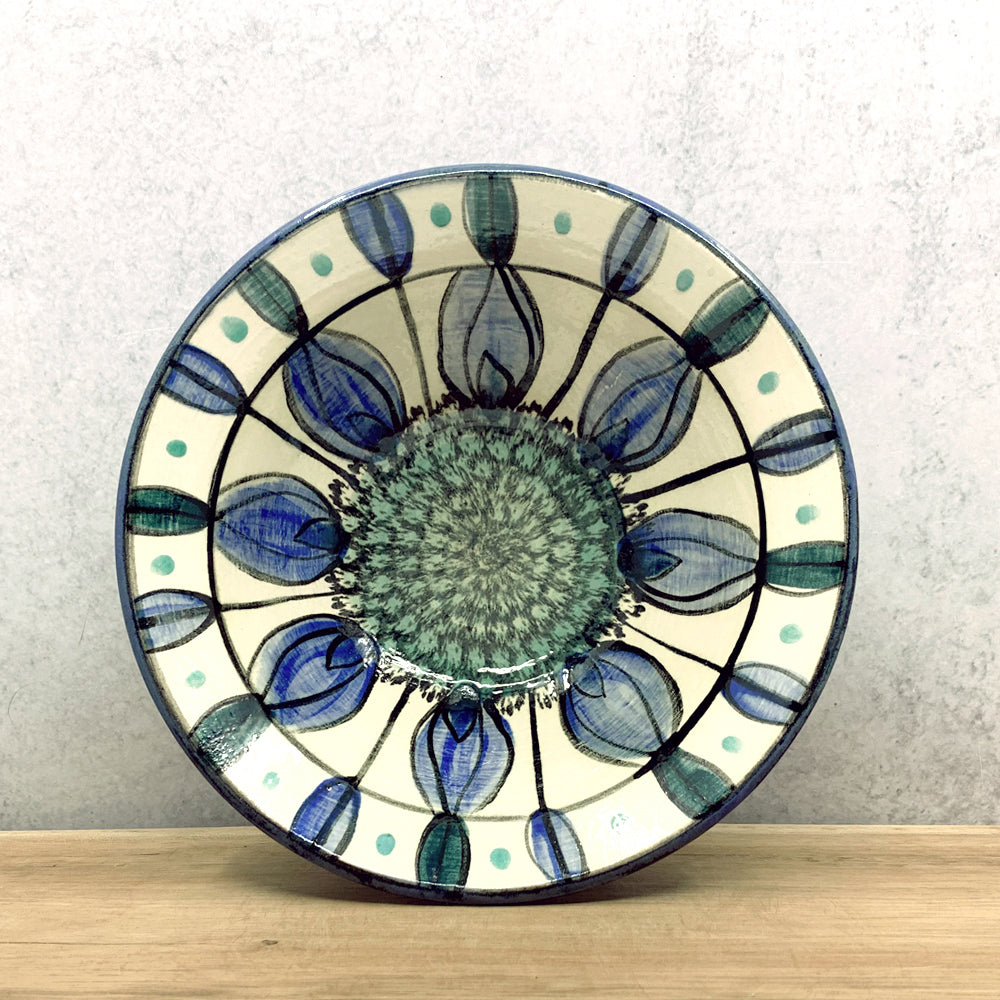 Handmade ceramic bowl with interior flower decoration by Molly Lithgo. Made in North Carolina.