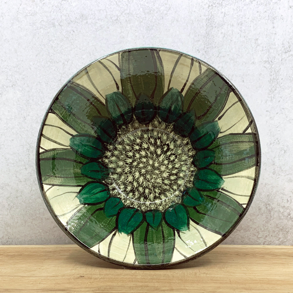 Handmade ceramic bowl with interior flower decoration by Molly Lithgo. Made in North Carolina.