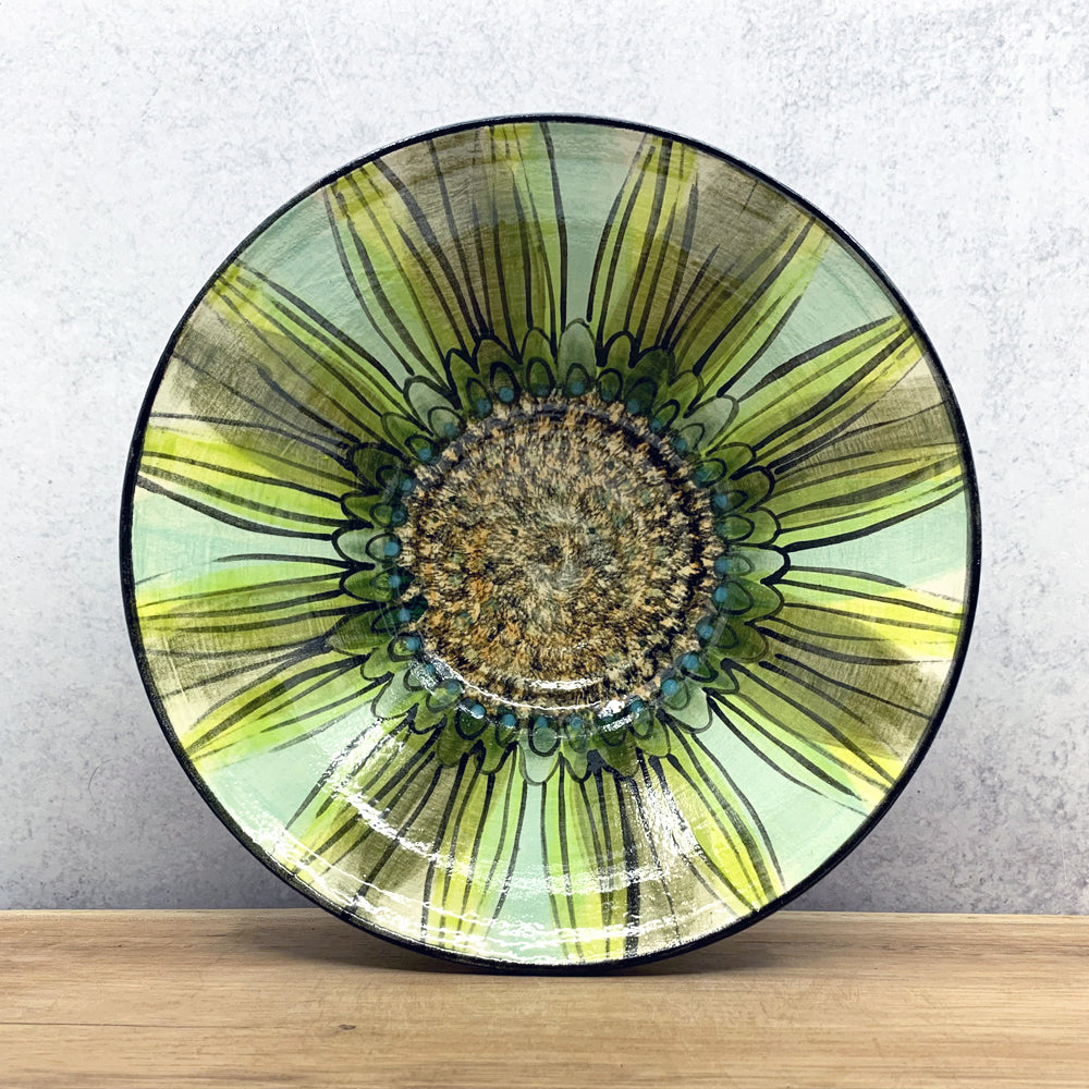 Handmade ceramic bowl with interior flower design by Molly Lithgo. Made in North Carolina.