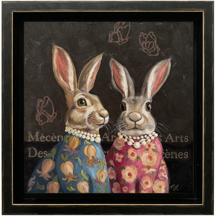 "Patrons of the Arts" rabbit painting by Ninalee Irani. Two rabbits wearing floral blouses and pearls. Butterfly motifs and the French translation of "Patrons of the Arts' are painted on the background behind them.