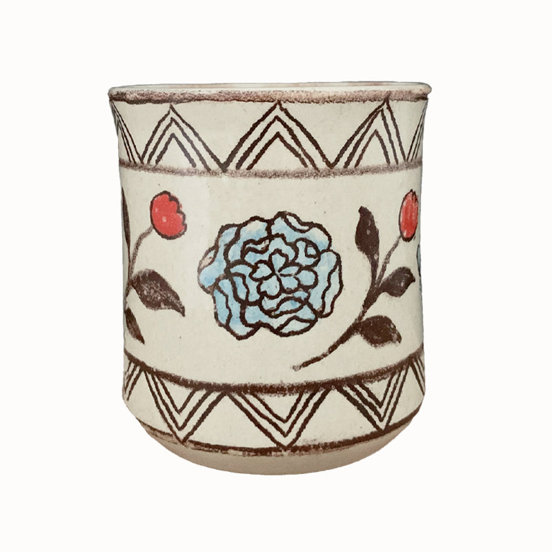 Handmade pottery from Off Menu Pots. Cup with blue and red flowers.
