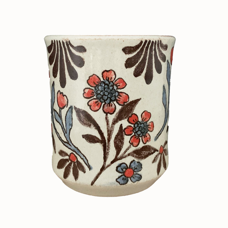 Handmade pottery from Off Menu Pots. Cup with red flowers.