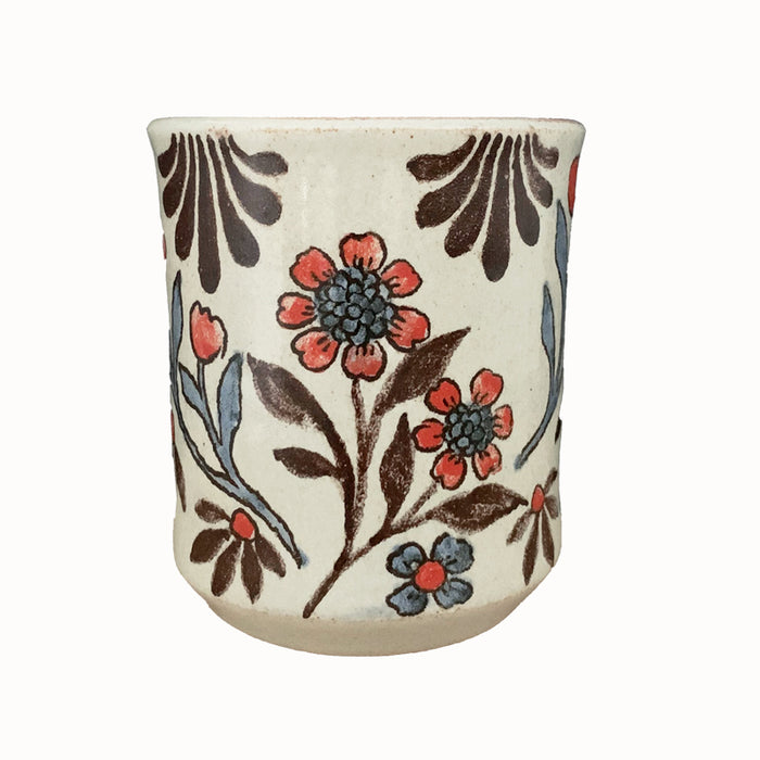 Handmade pottery from Off Menu Pots. Cup with red flowers.