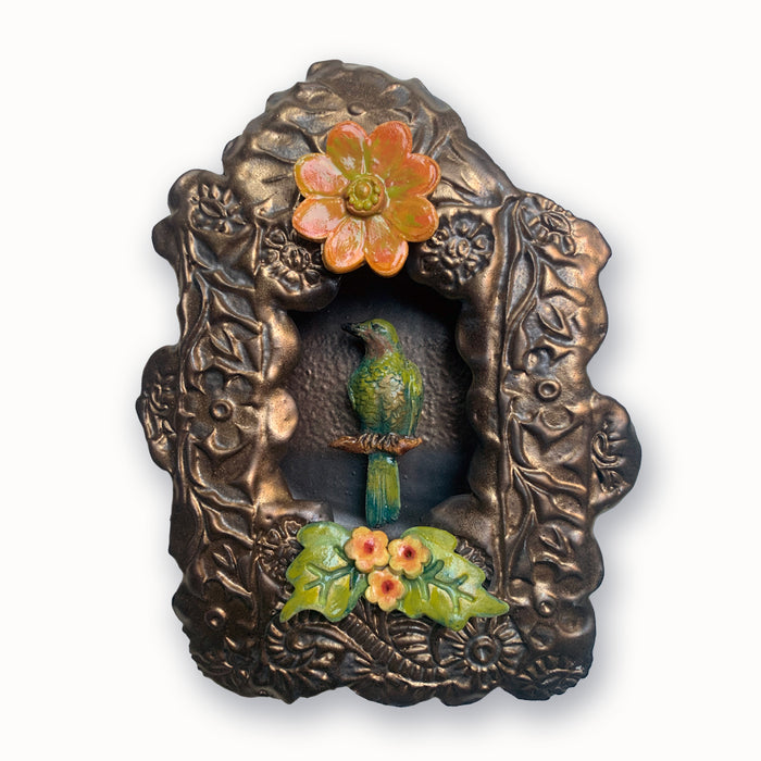 Handmade ceramic wall art by Paula Smith. Decorative, textured niche with bird and flower details. Available at larkandkey.com, Charlotte NC