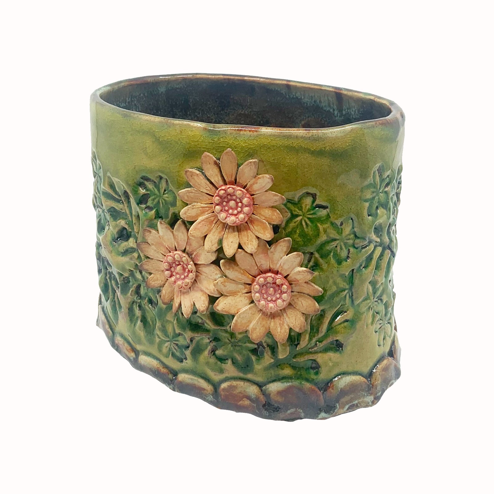 Green oval shaped ceramic vessel with stamped flower pattern and pink flowers by artist Paula Smith. Perfect on its own or used for various purposes - showcase fresh or dried flowers, store kitchen utensils, serving dish, hold mail, etc