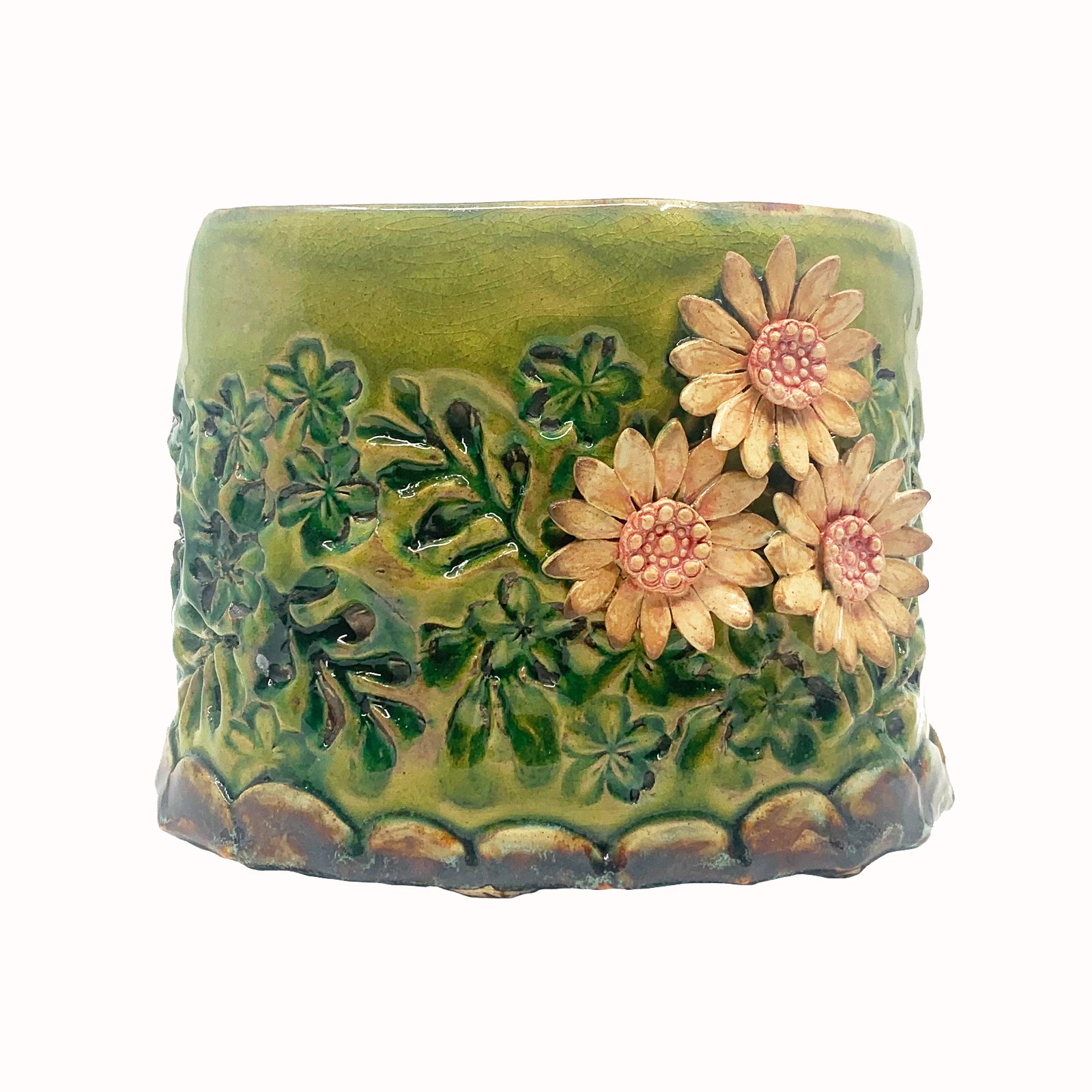 Green oval shaped ceramic vessel with stamped flower pattern and pink flowers by artist Paula Smith. Perfect on its own or used for various purposes - showcase fresh or dried flowers, store kitchen utensils, serving dish, hold mail, etc