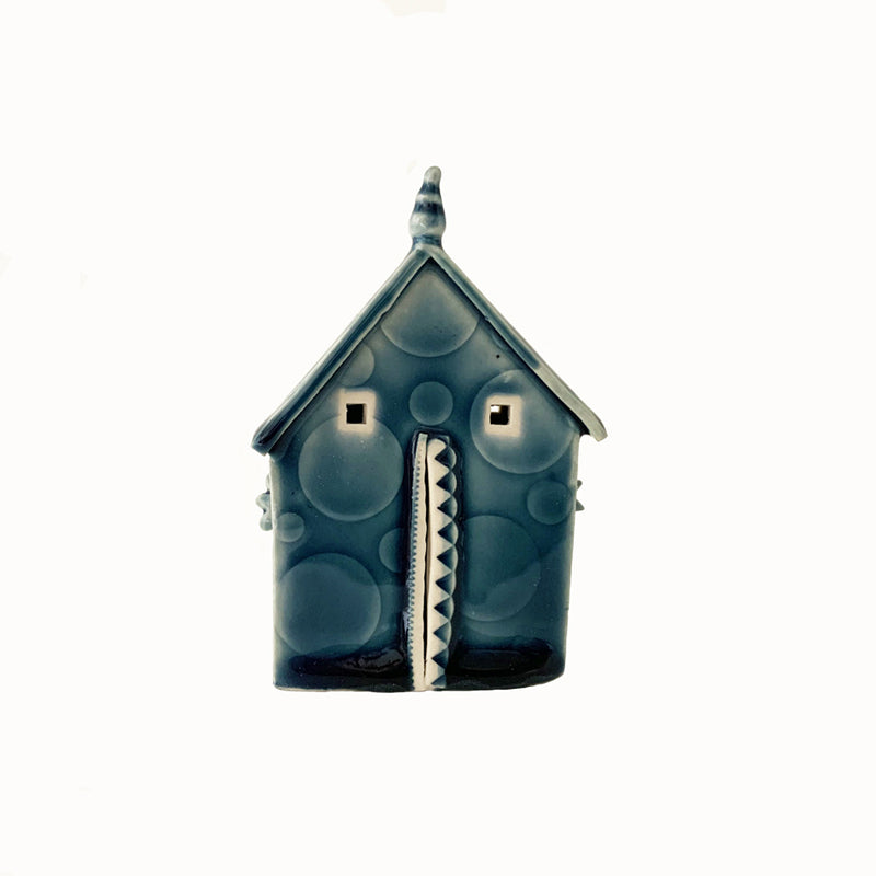 Handmade porcelain house by ceramic artist Barbara Chadwick, blue with dot details.