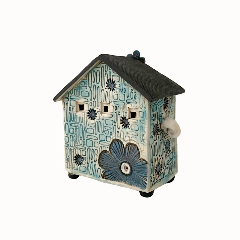 Handmade porcelain house by ceramic artist Barbara Chadwick, mod pattern with flowers. Back view.