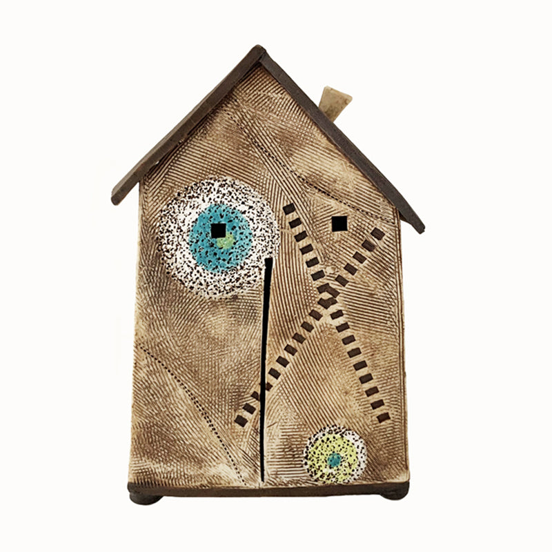 Handmade porcelain house by ceramic artist Barbara Chadwick, textured brown house with X and O details.