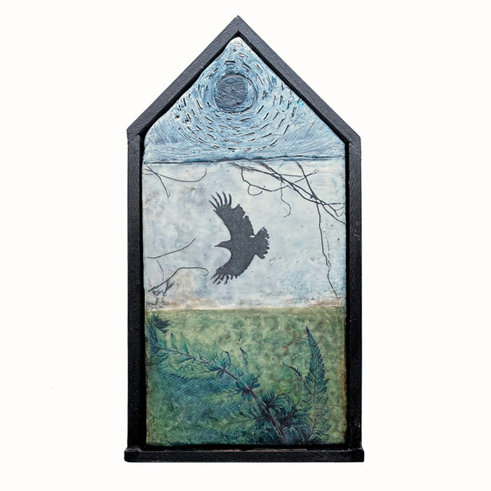 Small house shaped, mixed media encaustic artwork with fern, bird and moon imagery, set in black frame. 
