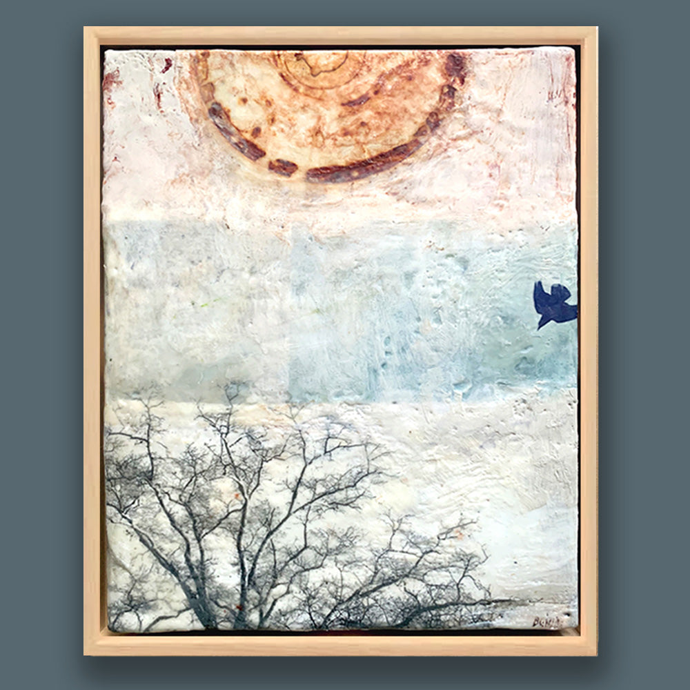 "Seeking Out an Anchor" painting by Bridgette Guerzon Mills.  Framed  mixed media encaustic artwork with abstract design, tree silhouette, and bird in flight.  Shown on a dark blue wall. 