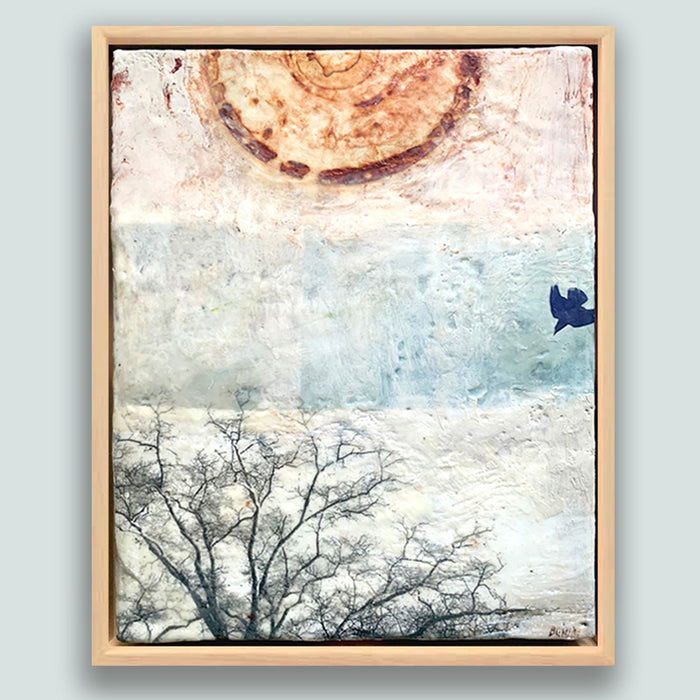 "Seeking Out an Anchor" painting by Bridgette Guerzon Mills.  Framed  mixed media encaustic artwork with abstract design, tree silhouette, and bird in flight.  Shown on pale blue wall.