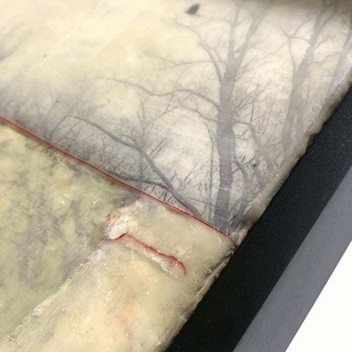"When the Blackbird Flew" painting by Bridgette Guerzon Mills.  Framed  mixed media encaustic artwork with tree silhouettes, bird in flight, vintage papers and red thread. Detail shown.