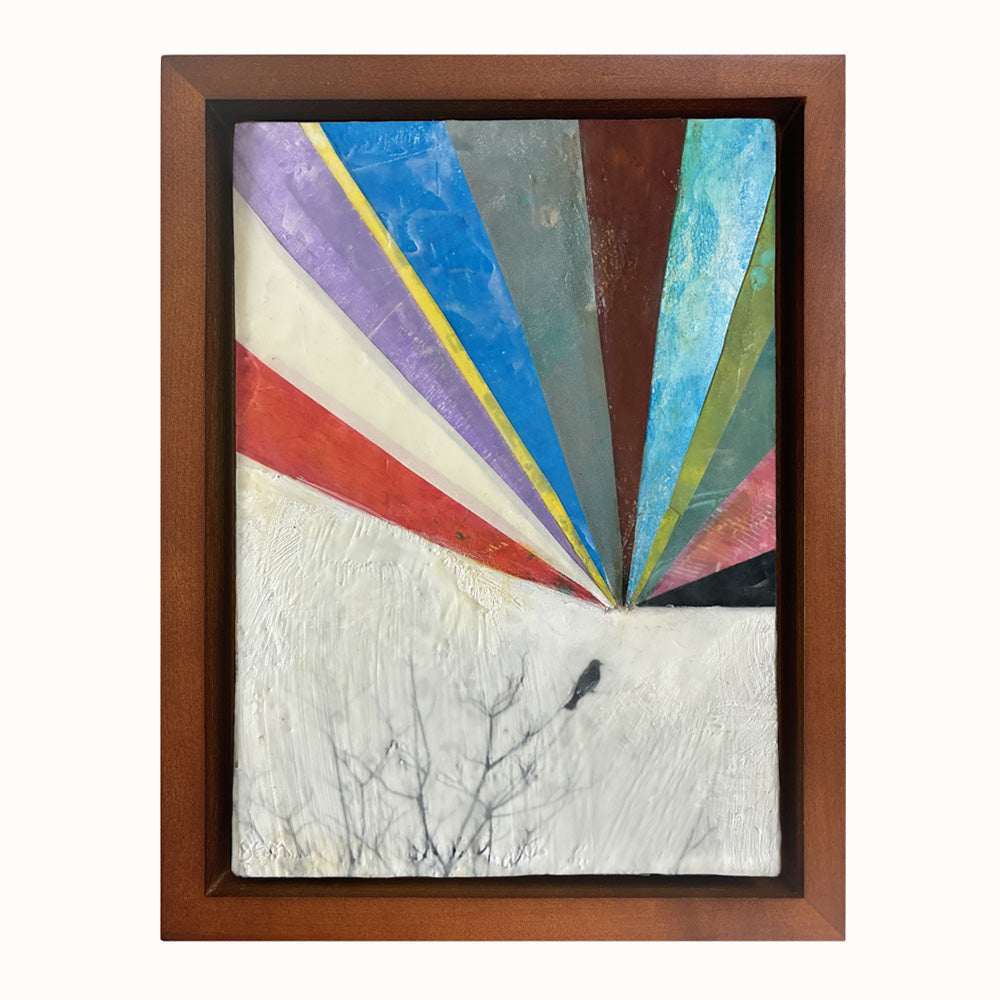 Artwork with colorful geometric design, and small bird in the top of a tree, set  in a wooden frame.