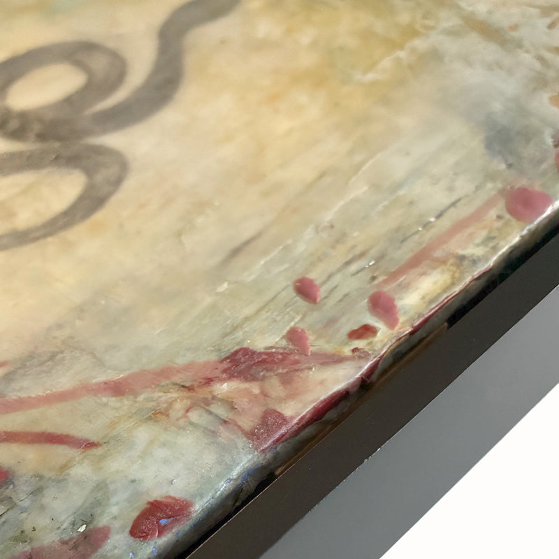 Mixed media artwork of a snake on a textured background with red botanical elements. Close up detail.