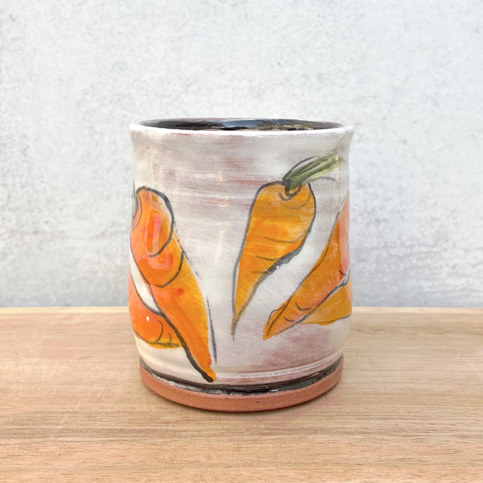 Handmade ceramic mug by NC potter Molly Lithgo. White with carrot  decoration. View 2.