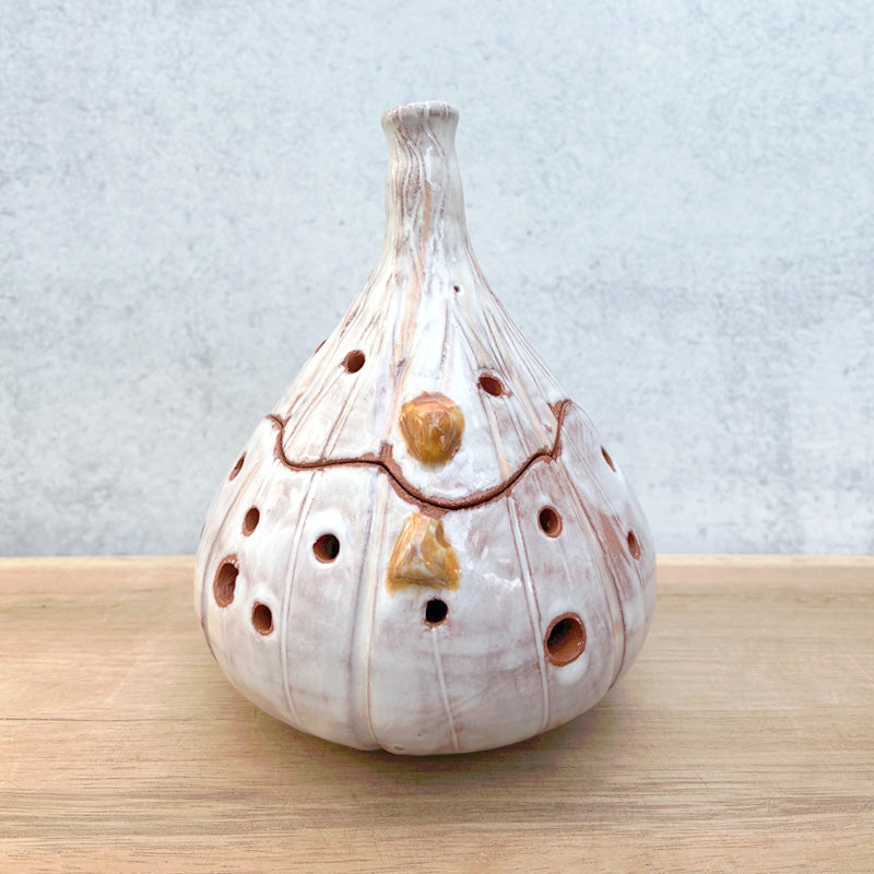 Handmade ceramic garlic keeper jar by Molly Lithgo, shaped like a garlic bulb.