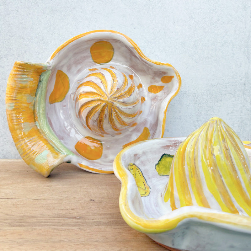 Handmade ceramic juicers by Molly Lithgo with orange and lemon decoration.