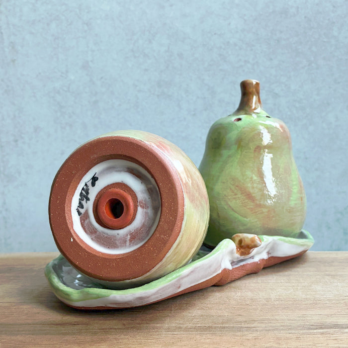 Ceramic pear salt and pepper shaker set with tray by Molly Lithgo. Image showing bottom of one of the shakers.
