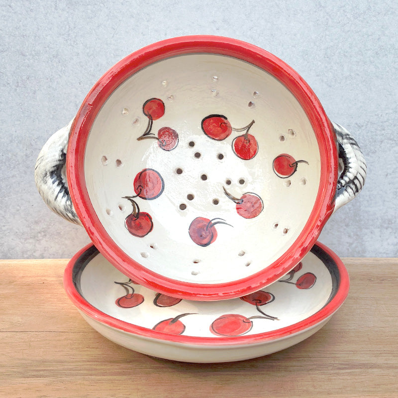 Handmade ceramic berry bowl and saucer with cherry decoration by Molly Lithgo. Interior and saucer view. 