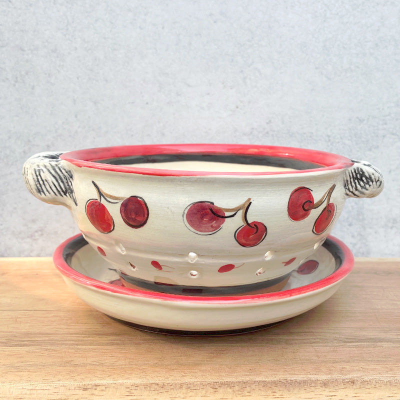 Handmade ceramic berry bowl and saucer with cherry decoration by Molly Lithgo. 