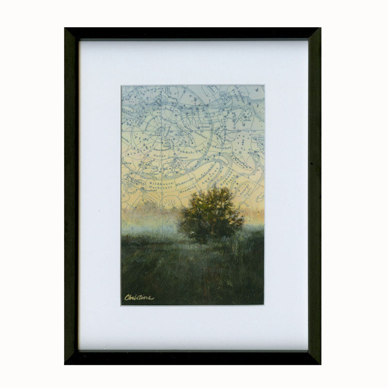 Small framed, mixed media landscape painting of a tree in a field beneath a celestial map sky.  Golden Summer artwork by Christina Keith, matted and framed in black. 