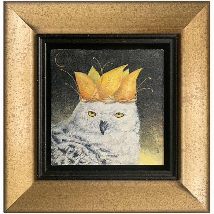 "Autumn Coronation" painting by Diane Savino. A snow owl wears a crown of golden leaves, with a sliver of the moon showing in a dark sky. The artwork is in a mottled gold frame.