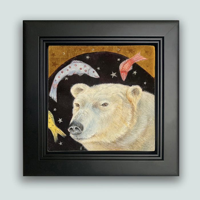 Night Fishing painting by Diane Savino, a polar bear dreams of fish under a starry sky. Framed in black and shown on light blue wall.
