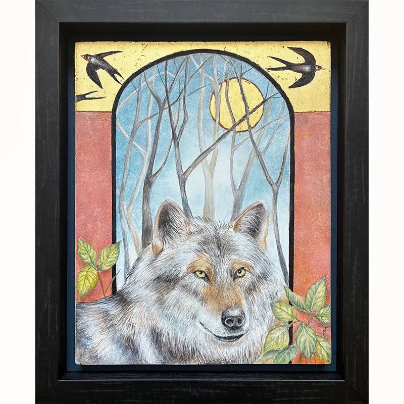 Illustrative egg tempera and gold leaf painting featuring a gray wolf in the foreground, an arched window-like scene with bare trees and a golden moon, two birds at the top, and red-orange side panels. The artwork, by Diane Savino, is set in a dark brown frame.