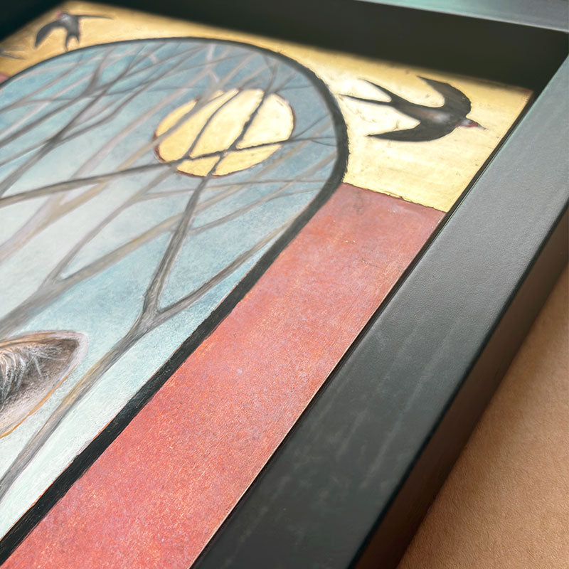 Illustrative egg tempera and gold leaf painting featuring a gray wolf in the foreground, an arched window-like scene with bare trees and a golden moon, two birds at the top, and red-orange side panels. The artwork, by Diane Savino, is set in a dark brown frame. Detail shown.