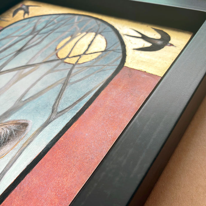Illustrative egg tempera and gold leaf painting featuring a gray wolf in the foreground, an arched window-like scene with bare trees and a golden moon, two birds at the top, and red-orange side panels. The artwork, by Diane Savino, is set in a dark brown frame. Detail shown.