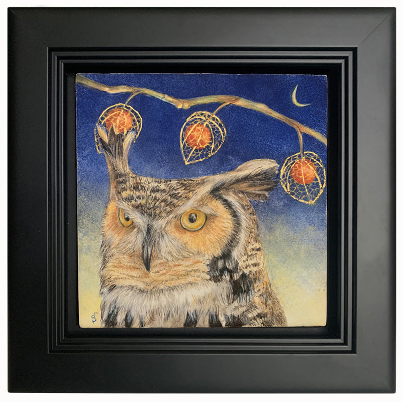 "Night's Awakening" painting by Diane Savino. A great horned owl sits under a brilliant blue night sky with crescent moon. A branch with three Chinese lantern flowers hangs overhead. The egg tempera and gold leaf painting is set in a black frame. 