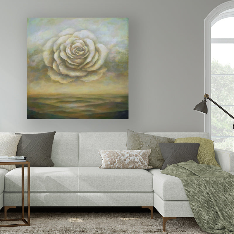 "Breathing Space" by artist Duy Huynh. A 42 x 42 x 2" acrylic on canvas painting depicting a large rose in the sky over an open landscape. Painting shown in a living room, above a sofa.