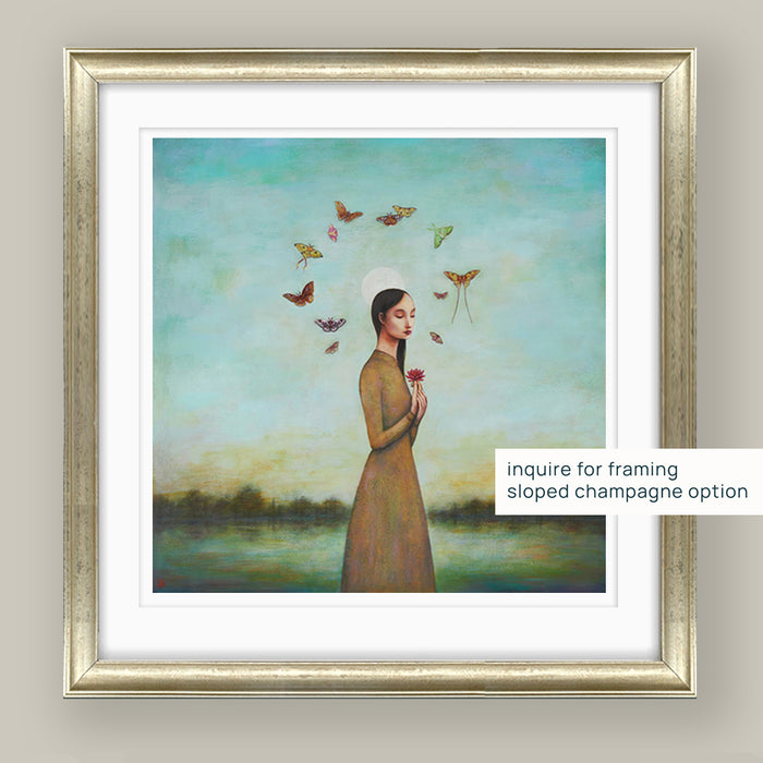 Duy Huynh's "Night Bloom" 12 x 12" limited edition print on paper with 1 inch white border (artist proof). A woman holds a water lily under a full moon at dusk with moths swirling overhead. Mockup with sloped champagne frame.